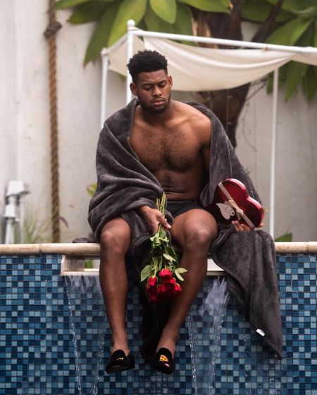 Juju Smith-Schuster alone holding a rose in the Valentine's day.